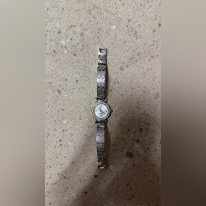 Coach Madison watch with a signature "C" logo stainless steel bangle bracelet.